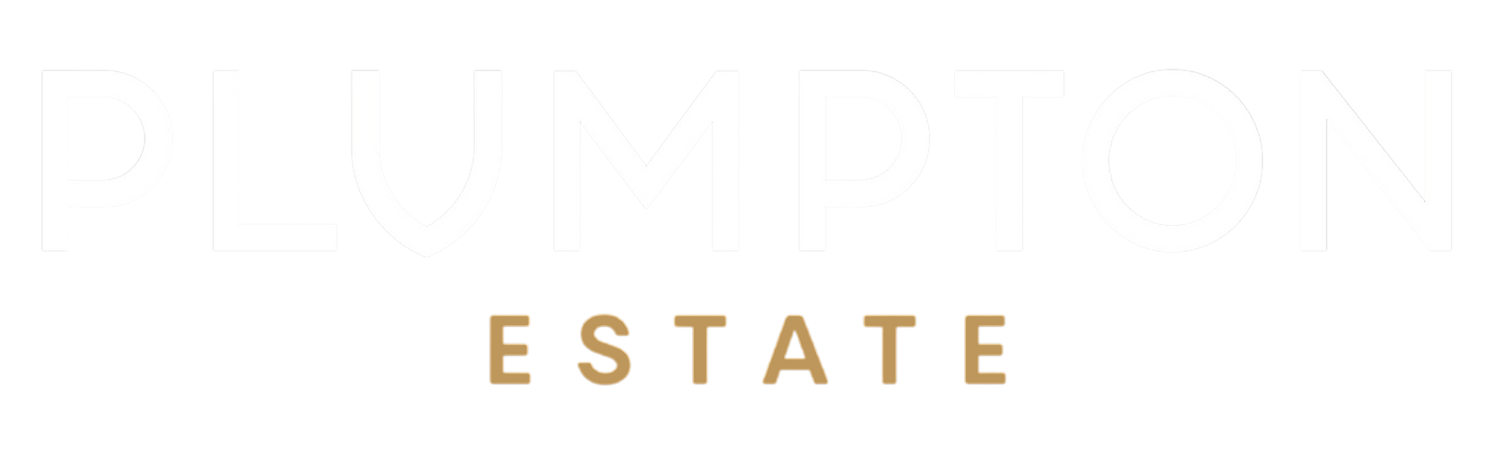 A minimalist graphic featuring the word 'PLUMPTON' in a very light gray serif font at the top, with 'ESTATE' centered below in a warm tan/gold serif font, all on a solid white background.